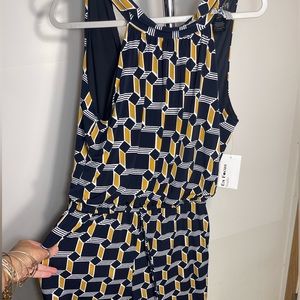 This is a jumpsuit called Enfocus Studio size 14 Blue / Gold and white in color